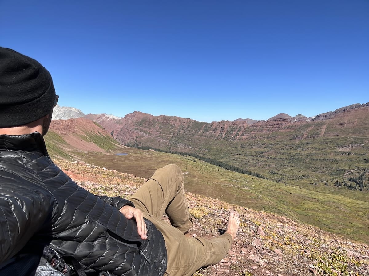 Four Pass Loop hiker resting in the North Fork Zone of the Snowmass Wilderness