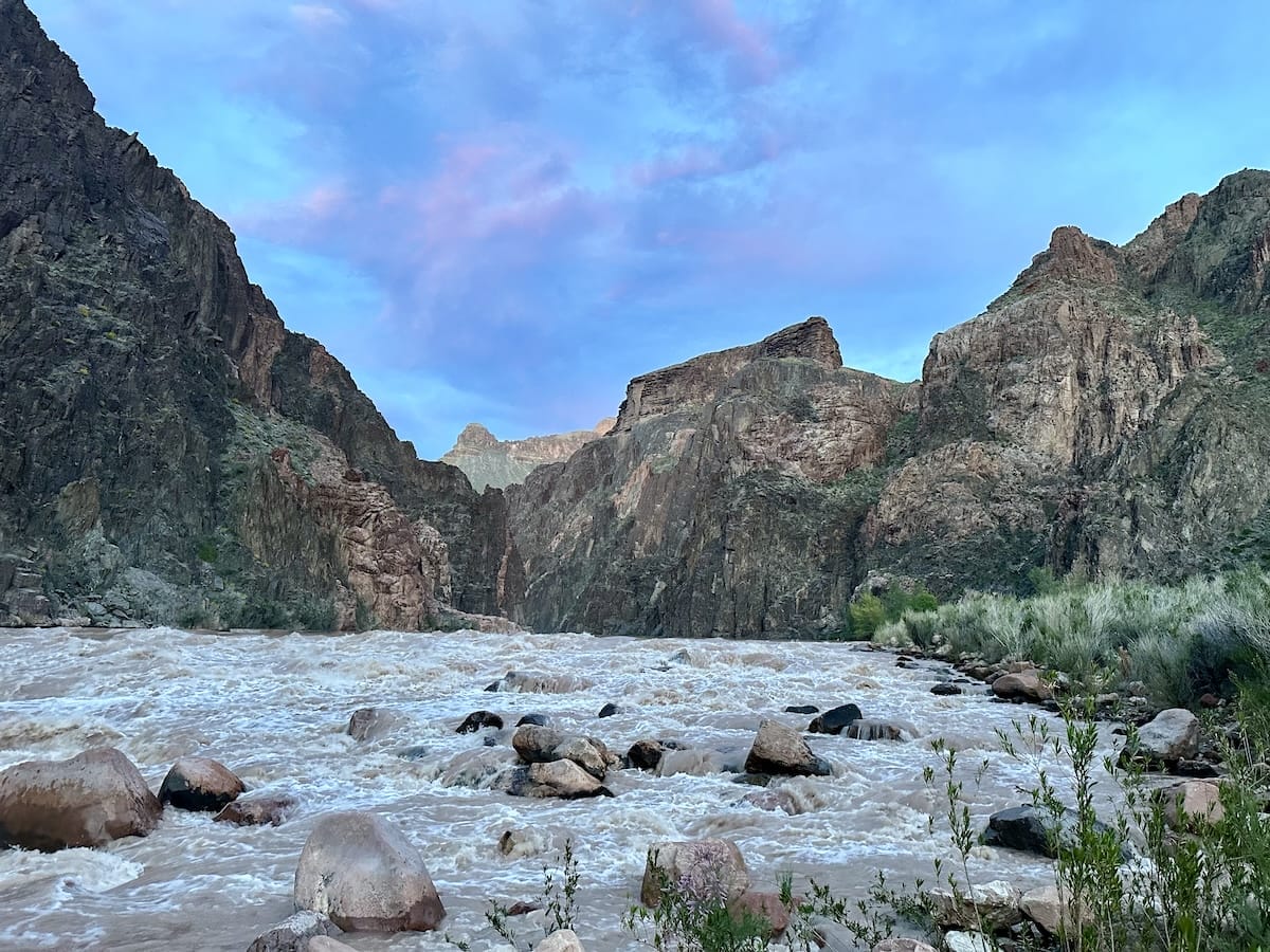 Colorado River at Granite Rapids campsite in Grand Canyon National Park, with rushing water and canyon views.