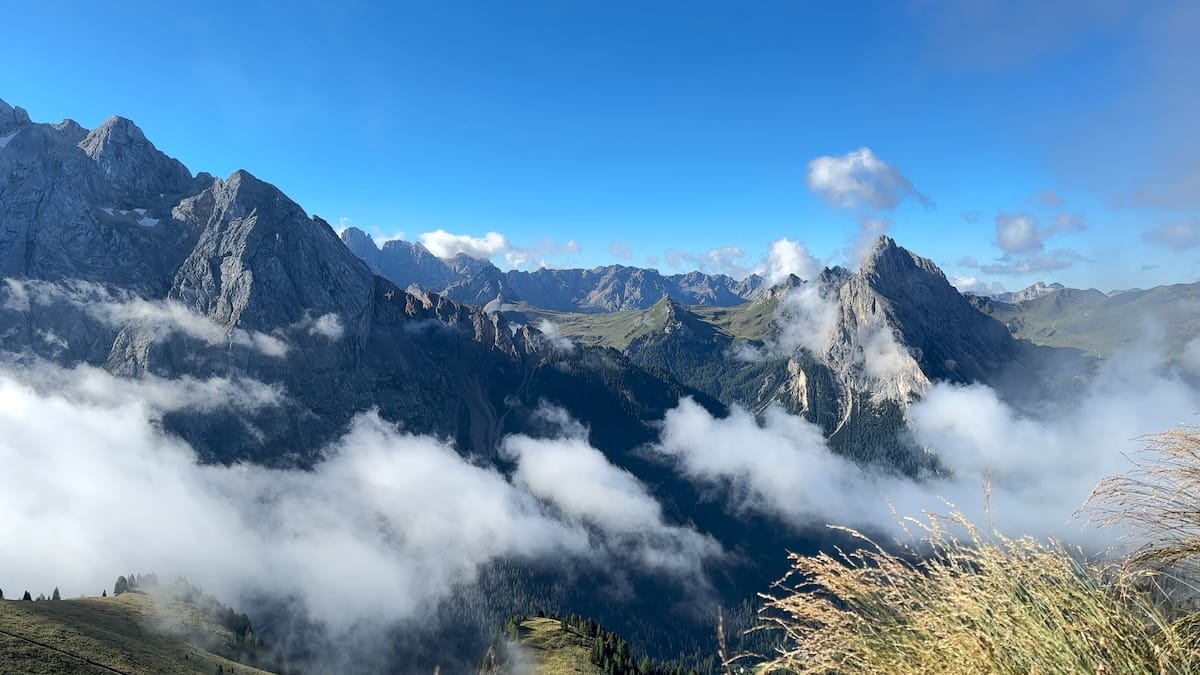 Panoramic view of the Dolomites with clouds along the Alta Via 2.