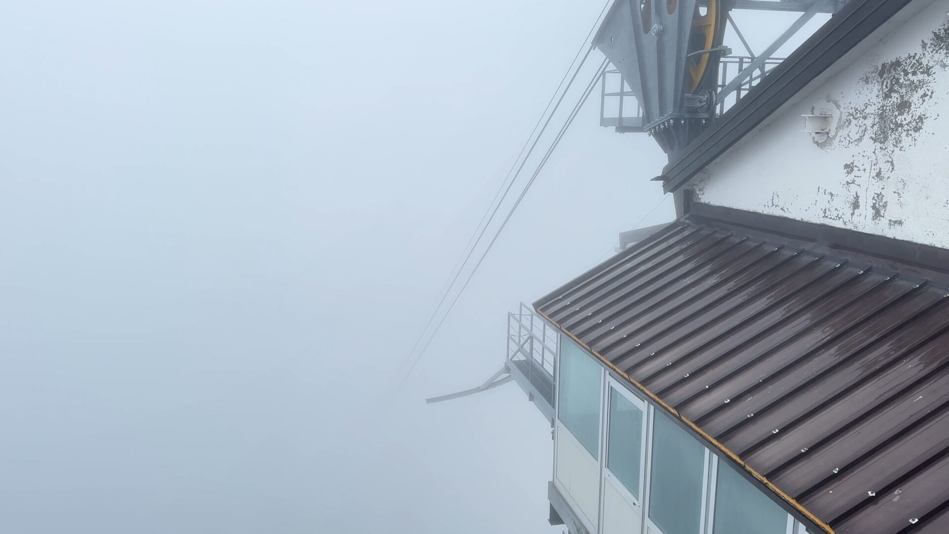 Cable car station view through fog at Rifugio Rosetta.